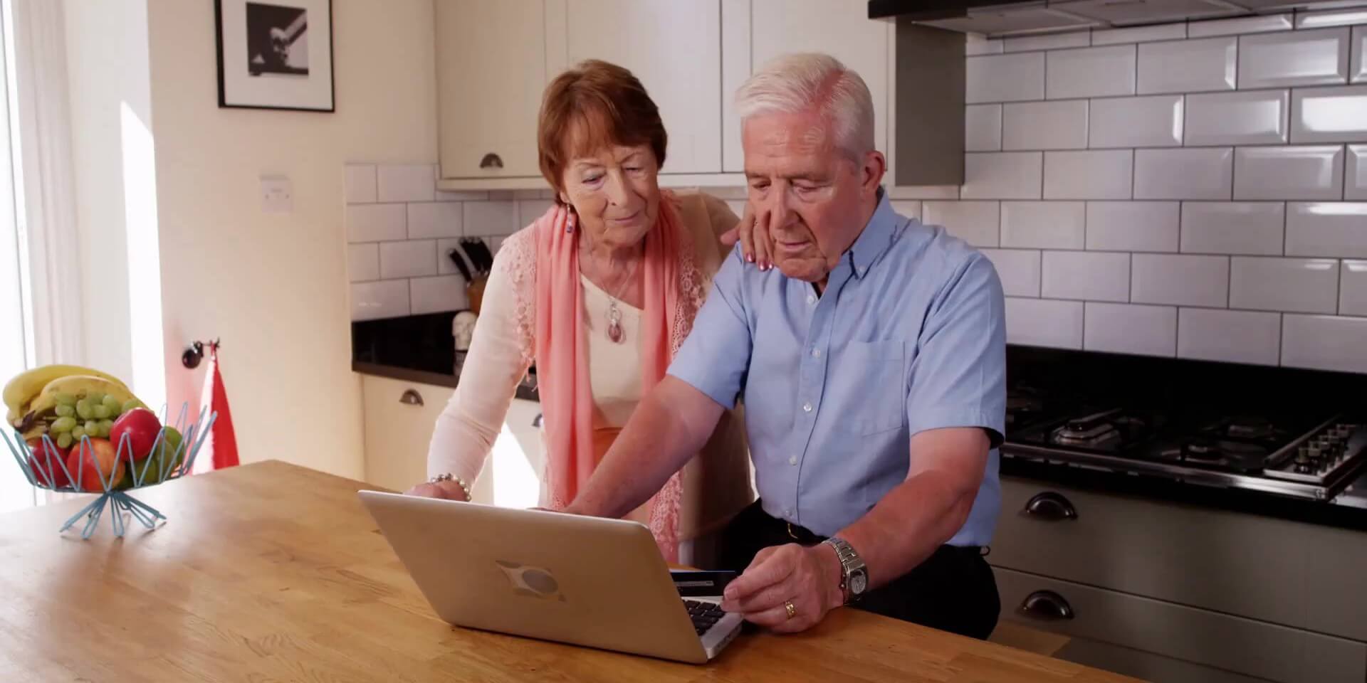 What to Expect After Moving Video Senior couple looking at a laptop together