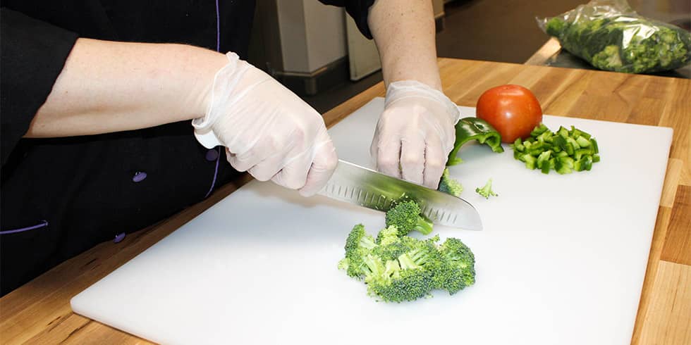 Cook - 1 Cook chopping vegetables