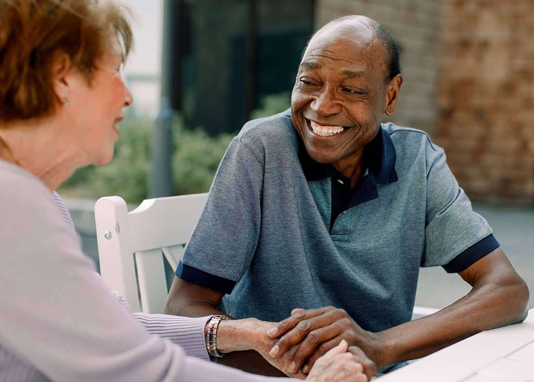 Elderly Man Outside Chatting with Woman Elderly man outside chatting with a woman