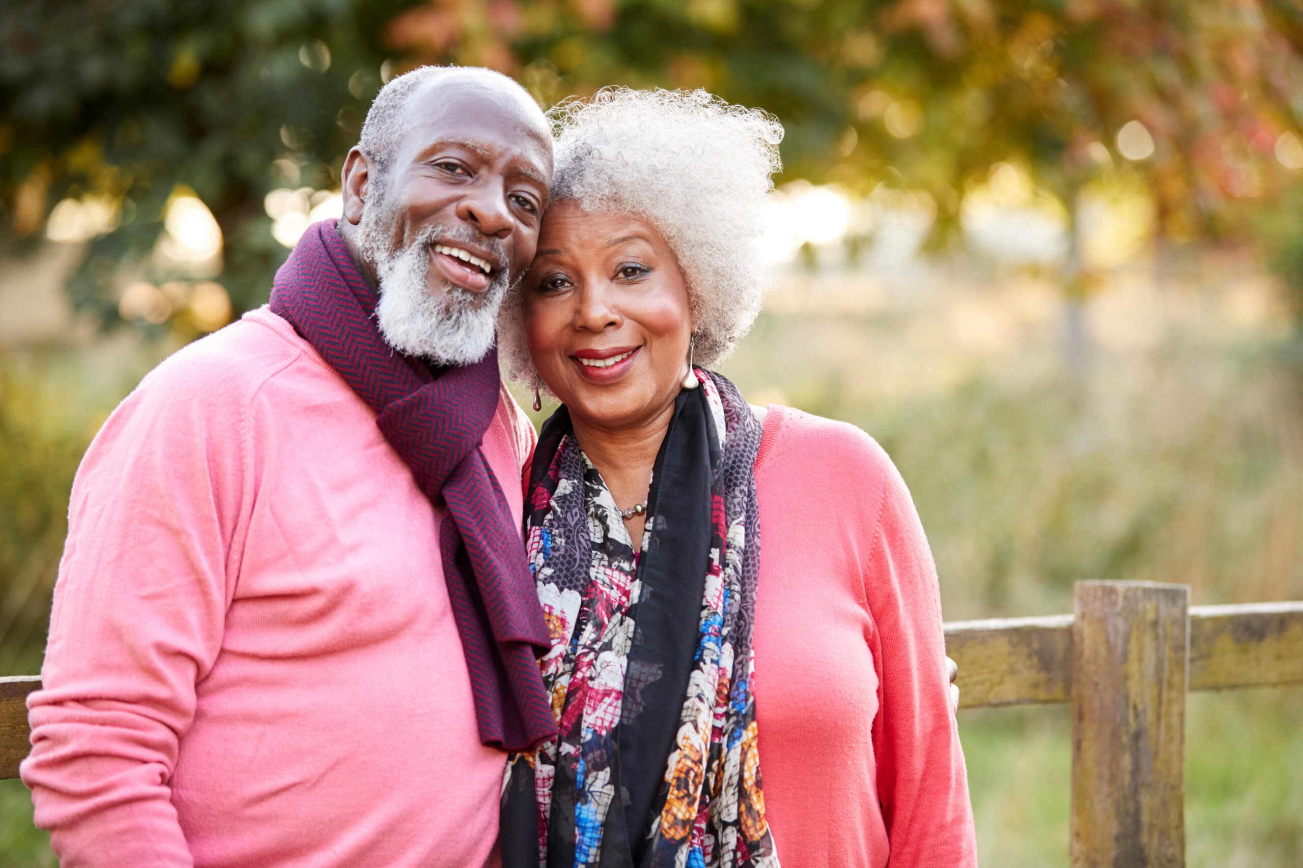 Elderly man outside chatting with a woman